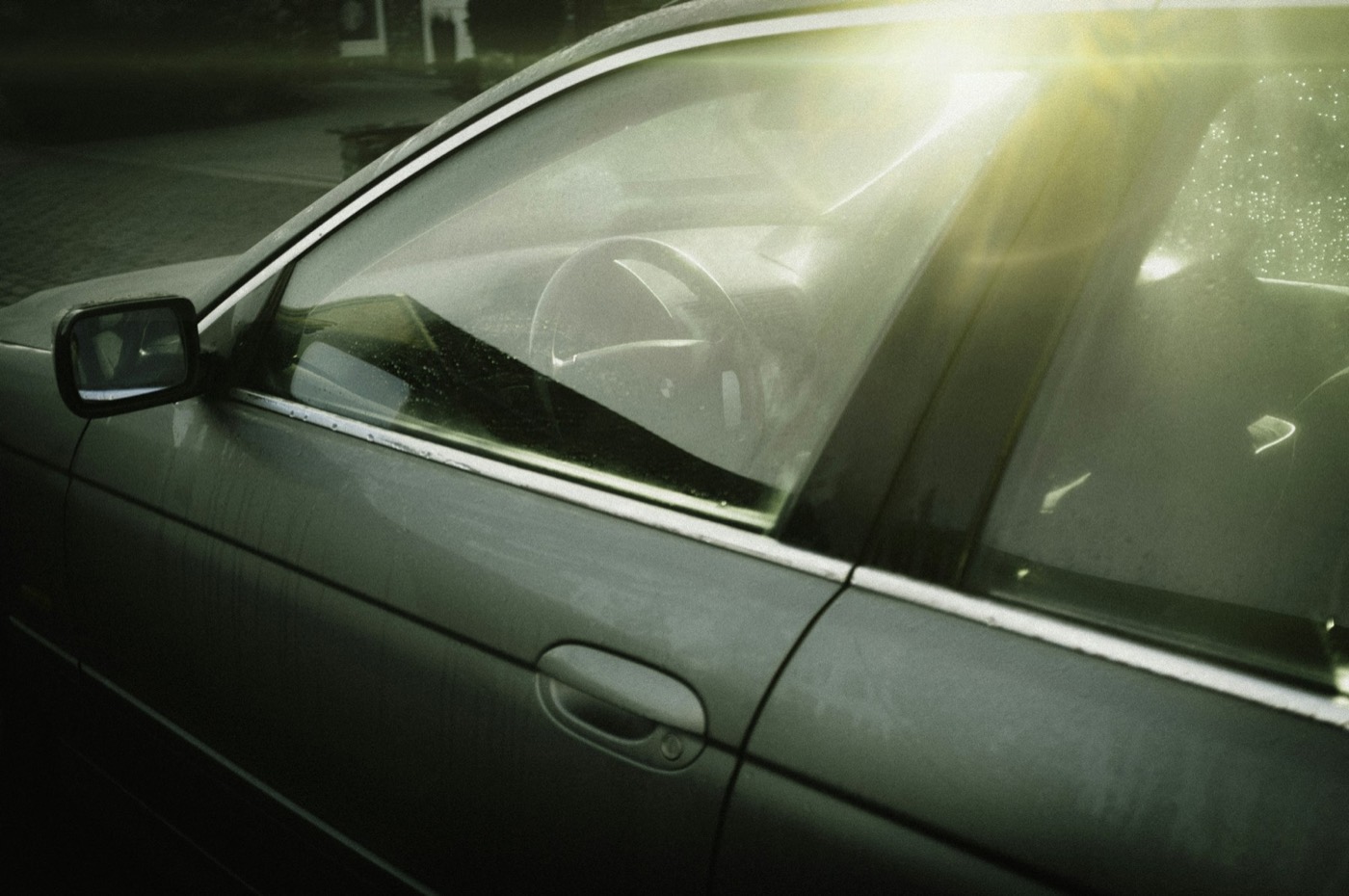 Sunlight across the side window of a car
